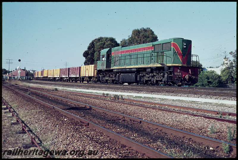 T06879
D Class 1564, Up goods train, East Perth, train has just crossed Mount Lawley Subway, Perth Terminal trackage in foreground, point rodding, searchlight signals, ER line
