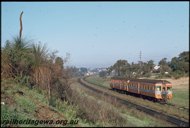 T07403
ADA/ADX Class railcar set, Down suburban passenger service, unidentified X Class on short Up goods train in distance, between Karrakatta and Shenton Park, ER line
