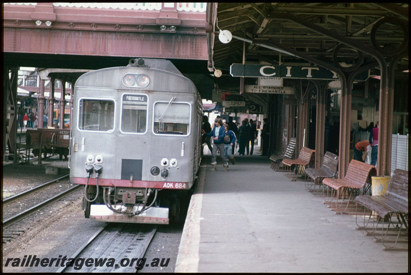 T07434
ADK Class 684 with ADB Class trailer, Up suburban passenger service, Platform 2, City Station, Perth, HE Class 721 low-sided wagon in stow road, Horseshoe Bridge, station nameboards, destination indicator, canopy, ER line
