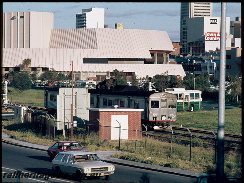 T07451
ADB/ADK Class railcar set, Down suburban passenger service, between West Perth and City, busway level crossing, Perth Entertainment Centre, ER line
