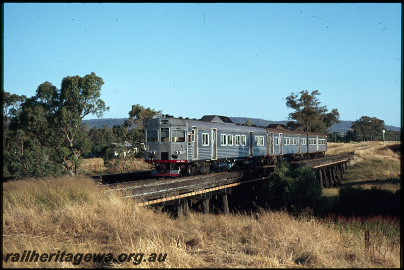 T07532
ADK Class 684 with an ADK/ADB Class railcar set, Up suburban passenger service, Canning River Bridge, timber trestle, between Gosnells and Stokely, SWR line
