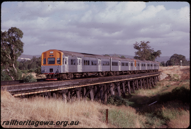 T07848
ADL/ADC/ADL/ADC class railcar set, Up suburban passenger service, Canning River bridge, timber trestle, between Gosnells and Stokley, searchlight signal, SWR line
