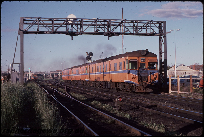 T08077
ADG Class 602 with ADG/ADA Class railcar set, Up suburban passenger service, departing Claisebrook, searchlight signal gantry, ground shunt signal, ER line
