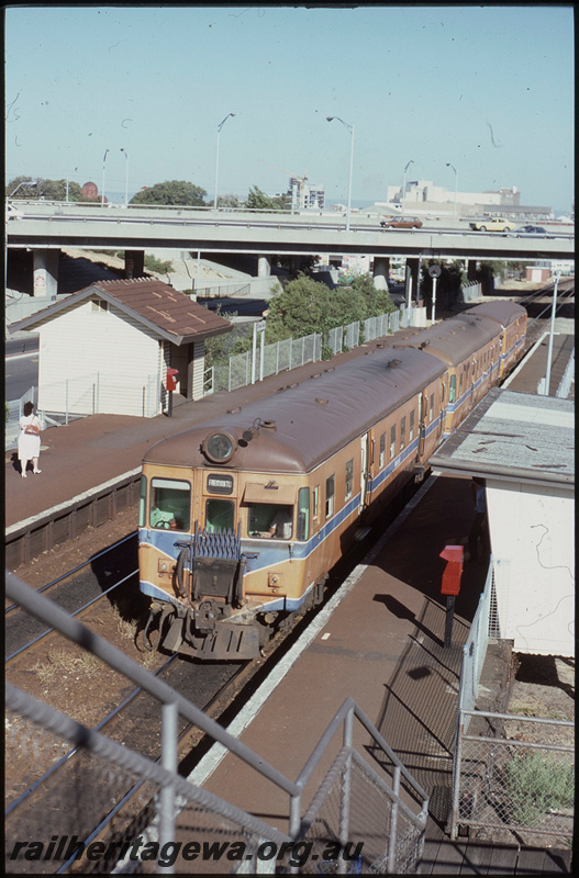 T08156
ADG/ADG/ADA Class railcar set, Up suburban passenger service, West Perth, platforms, station shelter, Mitchell Freeway overpass, ER line
