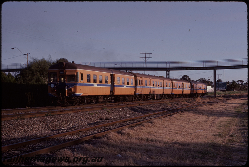 T08249
ADG/ADA/ADG/ADA Class railcar set, Up suburban passenger service, between Cottesloe and Mosman Park, footbridge, Leighton to Cottesloe freight line in foreground, ER line
