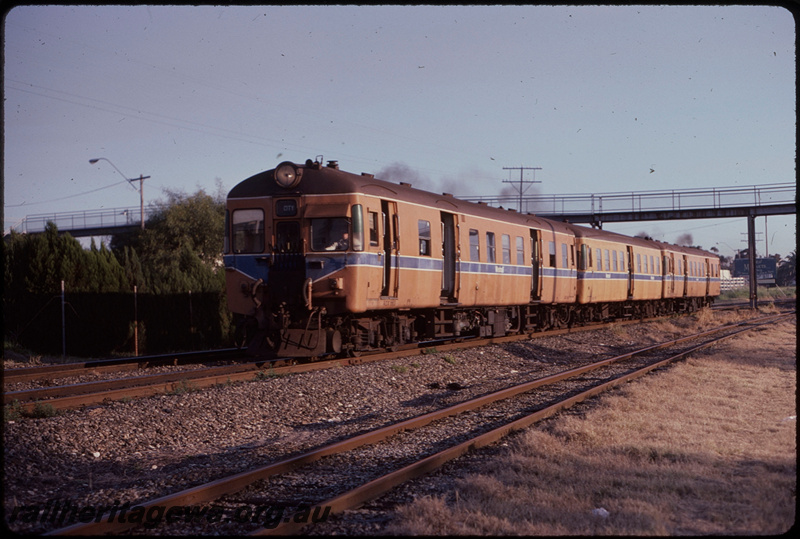 T08250
ADX Class 663, ADA Class trailer, ADX Class 662, Down suburban passenger service, last ADX Class railcar set in service, between Mosman Park and Cottesloe, footbridge, Leighton to Cottesloe freight line in foreground, ER line
