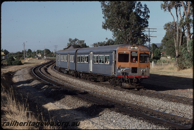 T08372
ADB Class 773 with ADK Class railcar, Down suburban passenger service, departing Stokley, Albany Highway level crossing, SWR line
