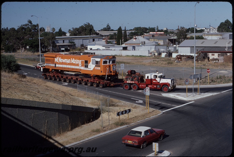T08390
Mount Newman Mining GE C36-7M 5506 (rebuilt from ALCo C636 5455), being transported from A Goninan & Co, Welshpool to the Pilbara on Bell Brothers low-bed trailer, turning from the Roe Highway off-ramp onto Clayton Street, Bellevue
