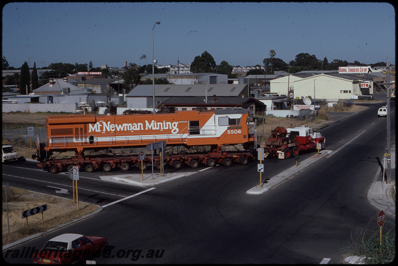 T08391
Mount Newman Mining GE C36-7M 5506 (rebuilt from ALCo C636 5455), being transported from A Goninan & Co, Welshpool to the Pilbara on Bell Brothers low-bed trailer, turning from the Roe Highway off-ramp onto Clayton Street, Bellevue
