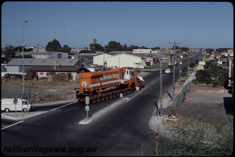 T08392
Mount Newman Mining GE C36-7M 5506 (rebuilt from ALCo C636 5455), being transported from A Goninan & Co, Welshpool to the Pilbara on Bell Brothers low-bed trailer, turning from the Roe Highway off-ramp onto Clayton Street, Bellevue
