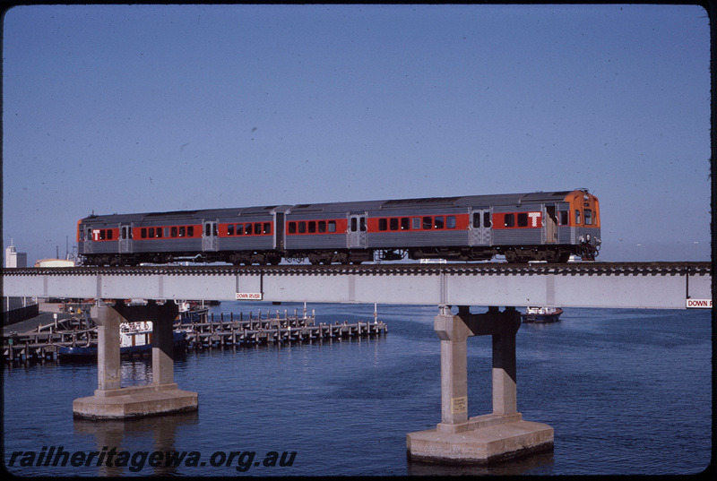 T08483
C Class 1702, stabled in carriage sidings, Perth Yard, Queensland Railways (QR) SXV Class carriage, ER line

