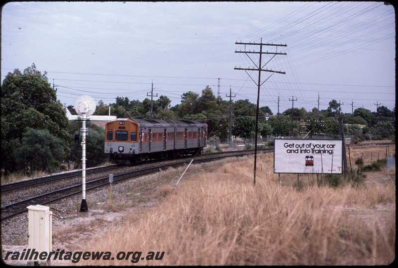 T08612
ADL Class 802 and ADC Class 852, Up suburban passenger service, between Welshpool and Oats Street, searchlight signal, relay box, Transperth advert on billboard with slogan 