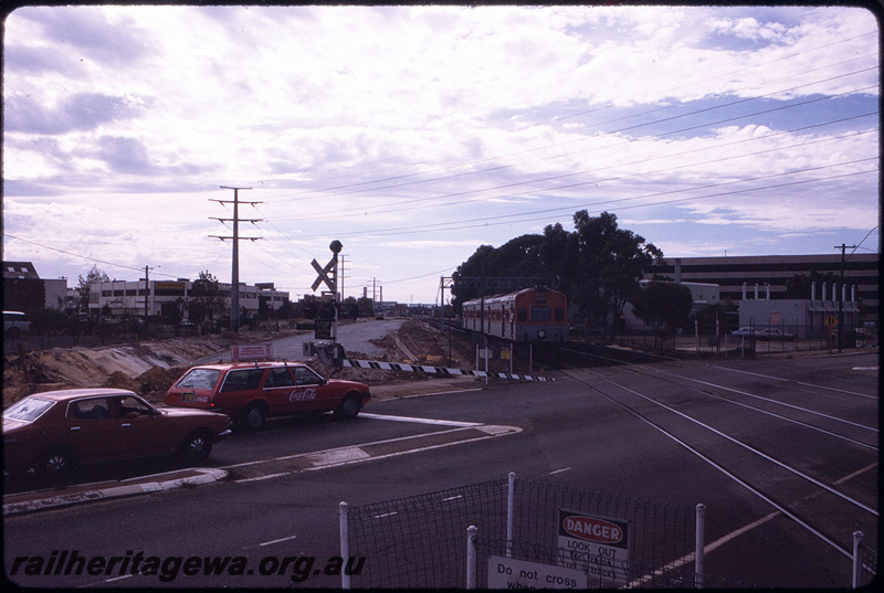 T08645
ADC Class 854 and ADL Class 804, Down suburban passenger service, between City Station and Claisebrook, Moore Street level crossing, earthworks underway for construction of additional trackwork and McIver Station, ER line
