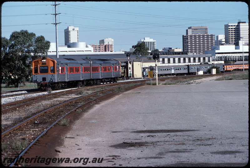 T08700
ADC/ADL Class railcar set, Down suburban passenger service, between Claisebrook and East Perth, Claisebrook Railcard Depot in background, searchlight signals, ER line
